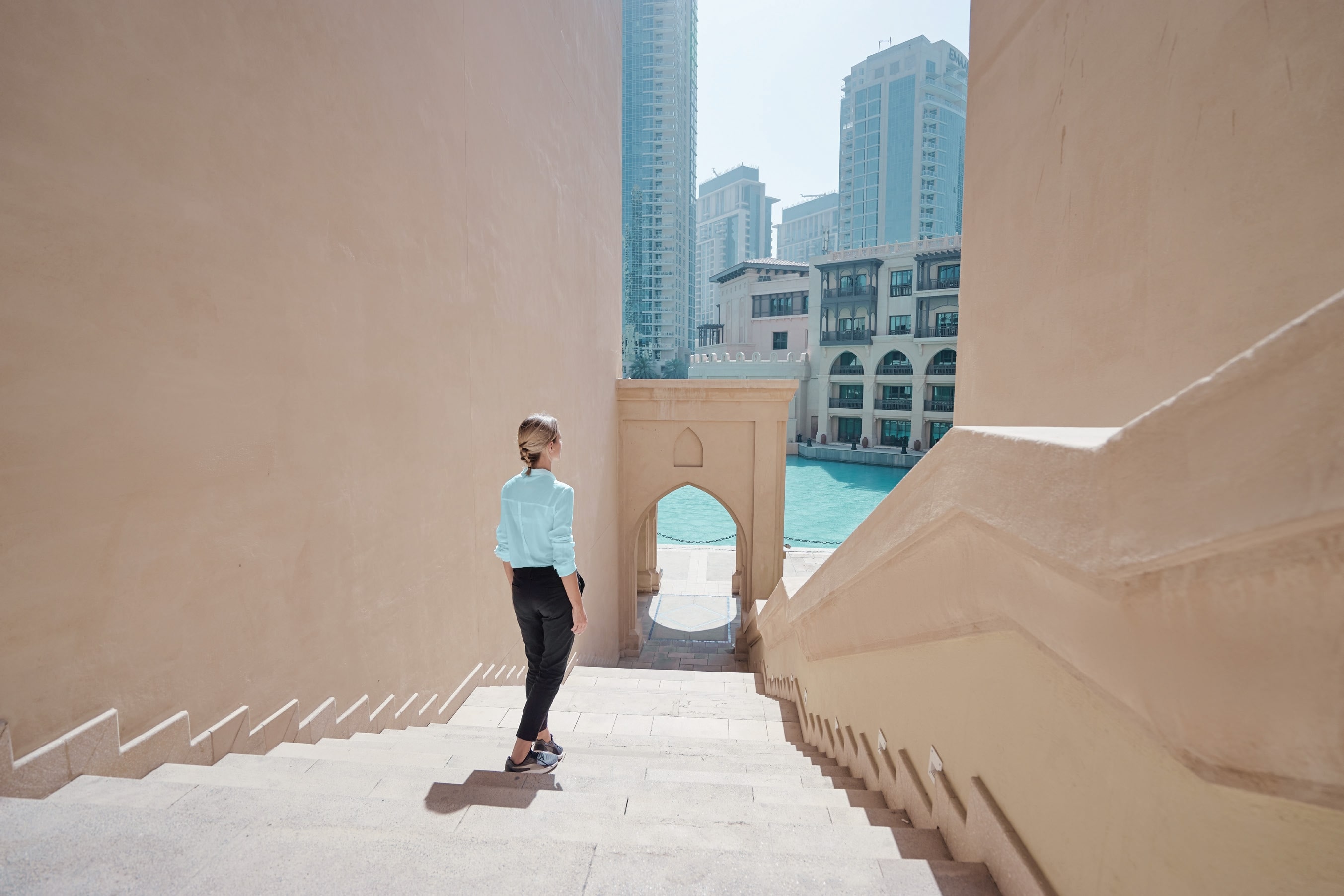 Woman walking in a modern waterfront community